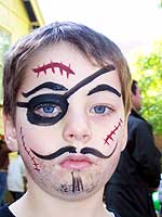 A boy with a pirate face painting by Denise Dutil - Entertainer for Kids