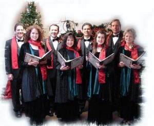a choir holding choirbooks on the foreground with a Christmas tree in the background