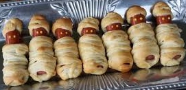 Hotdogs wrapped in dough to create a mummified look
