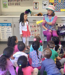 Denise interacts with the kids during her Magic Comedy Show at a preschool birthday party.