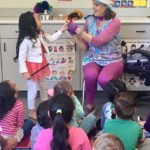 Kid's entertainer Denise encourages children to participate during her Magic Comedy Show at a preschool birthday party.