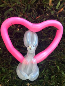 balloons twisted into the shape of a bunny in a heart