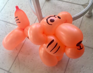 orange balloons twisted into the shape of a tiger